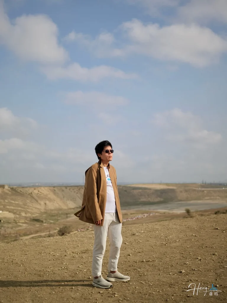 Lu Heng: Visionary Entrepreneur on a Windy Hilltop Luheng-standing-on-windy-hilltop-under-clouds