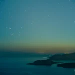 Star-Filled Night Sky Over Calm Sea and Distant Islands Night-sky-over-sea-and-distant-islands