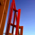 Red-modern-architectural-structure-under-evening-sky