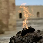 Flame rising from a bed of stone Sacred-eternal-flame-burning-on-stone-altar