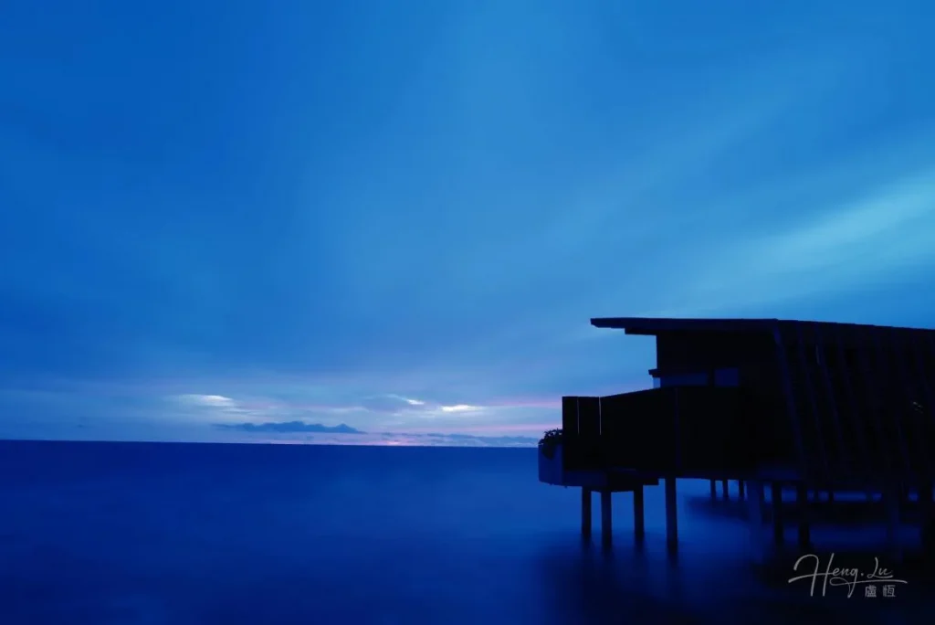 Serene Sea Villaat Dusk Silhouette-of-sea-villa-on-stilts-over-ocean