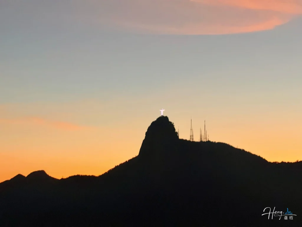 Evening glow over a mountain ridge Sunset-silhouette-with-mountain-and-statue