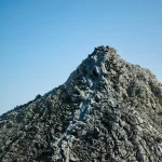 Textured-mountain-peak-under-clear-sky