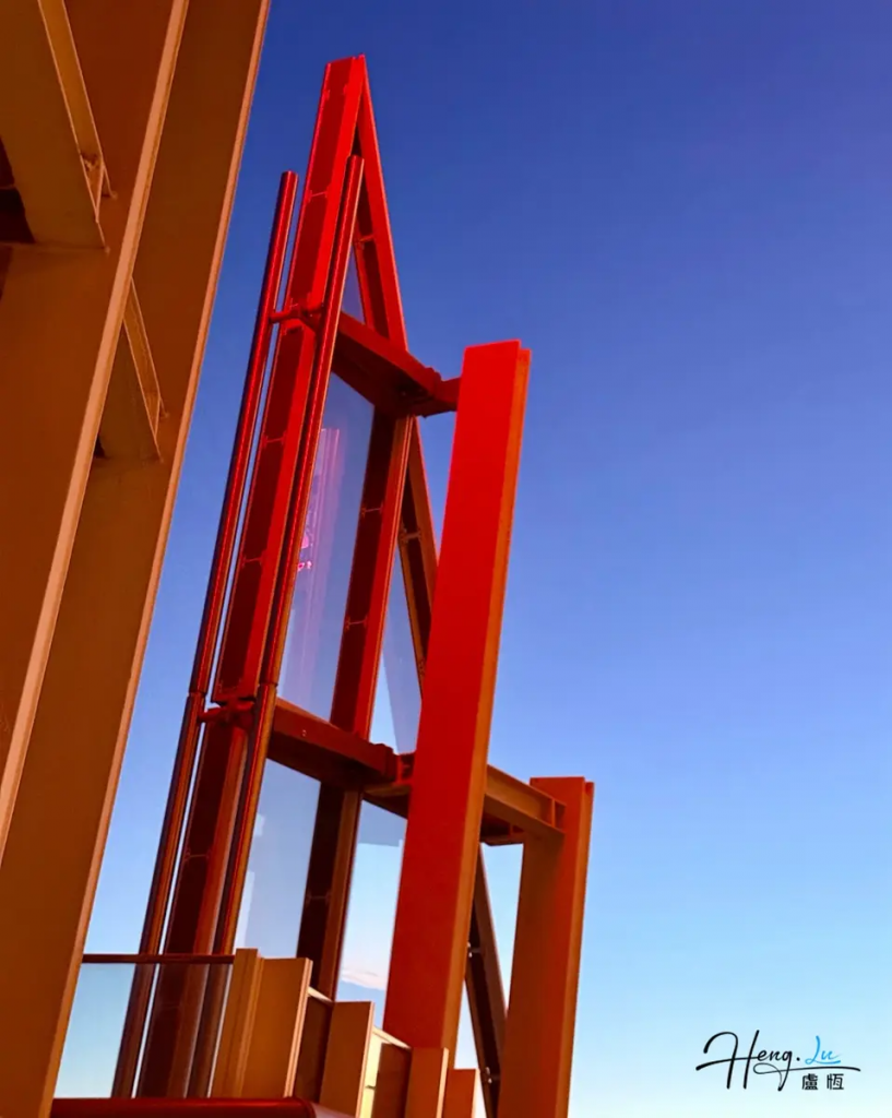 A Bold Red Structure Against the Evening Sky