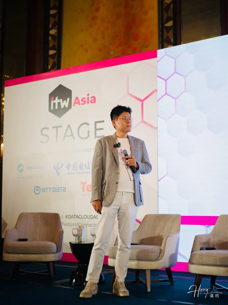 Lu Heng Standing on ITW Asia Stage During Tech Conference Presentation luheng-standing-on-itw-asia-stage-during-conference