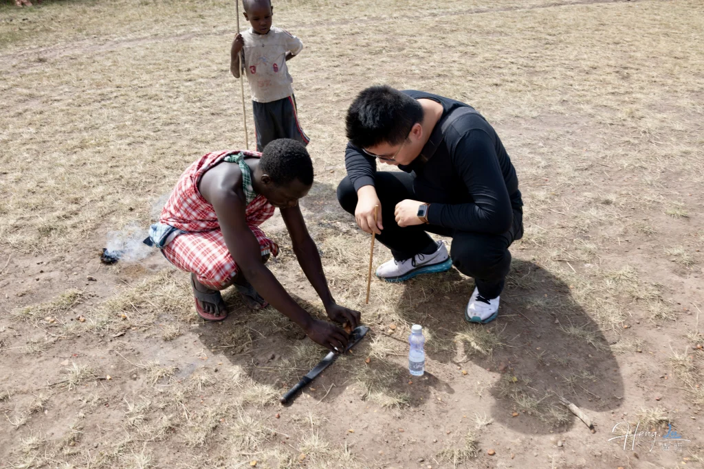 Luheng learning fire making with local guide in open field Luheng-learning-fire-making-with-local-guide-in-open-field