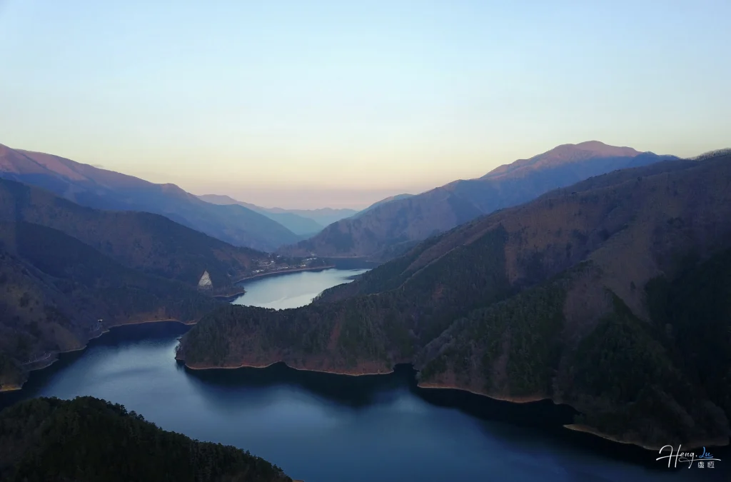 Mountain valley reflecting evening sky over lake mountain-valley-reflecting-evening-sky-over-lake