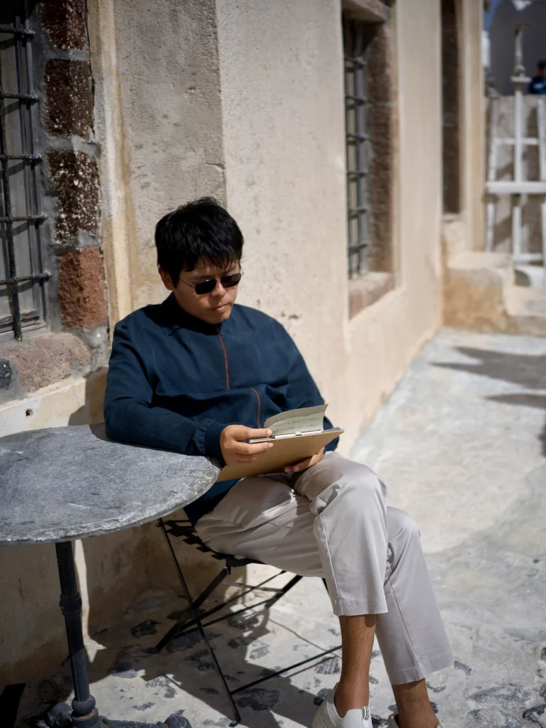 Portrait of Lu Heng reading outdoors by stone wall under sunlight portrait-of-luheng-reading-outdoors-by-stone-wall-under-sunlight
