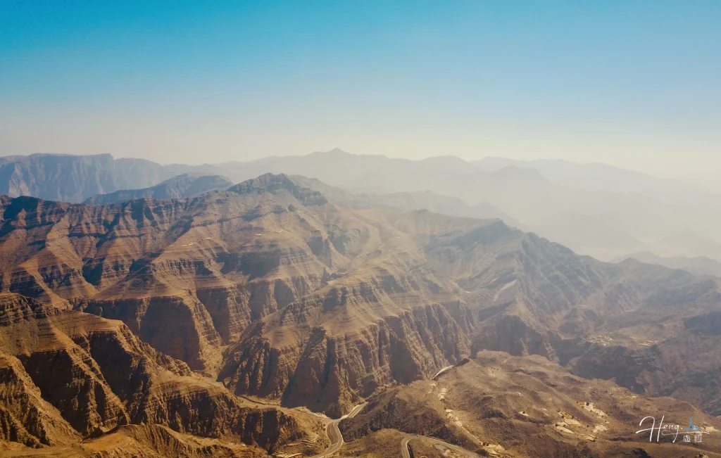Rugged mountain range under clear blue sky rugged-mountain-range-under-clear-blue-sky
