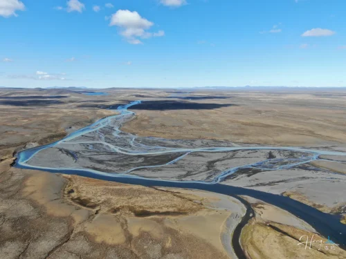 Aerial-view-of-river-delta-under-clear-blue-sky