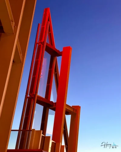 Red-modern-architectural-structure-under-evening-sky